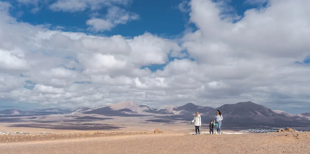 A happy family walking on a beach in Lanzarote
