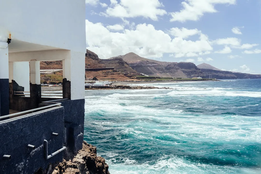 Dramatic rocky coastline with waves crashing against cliffs