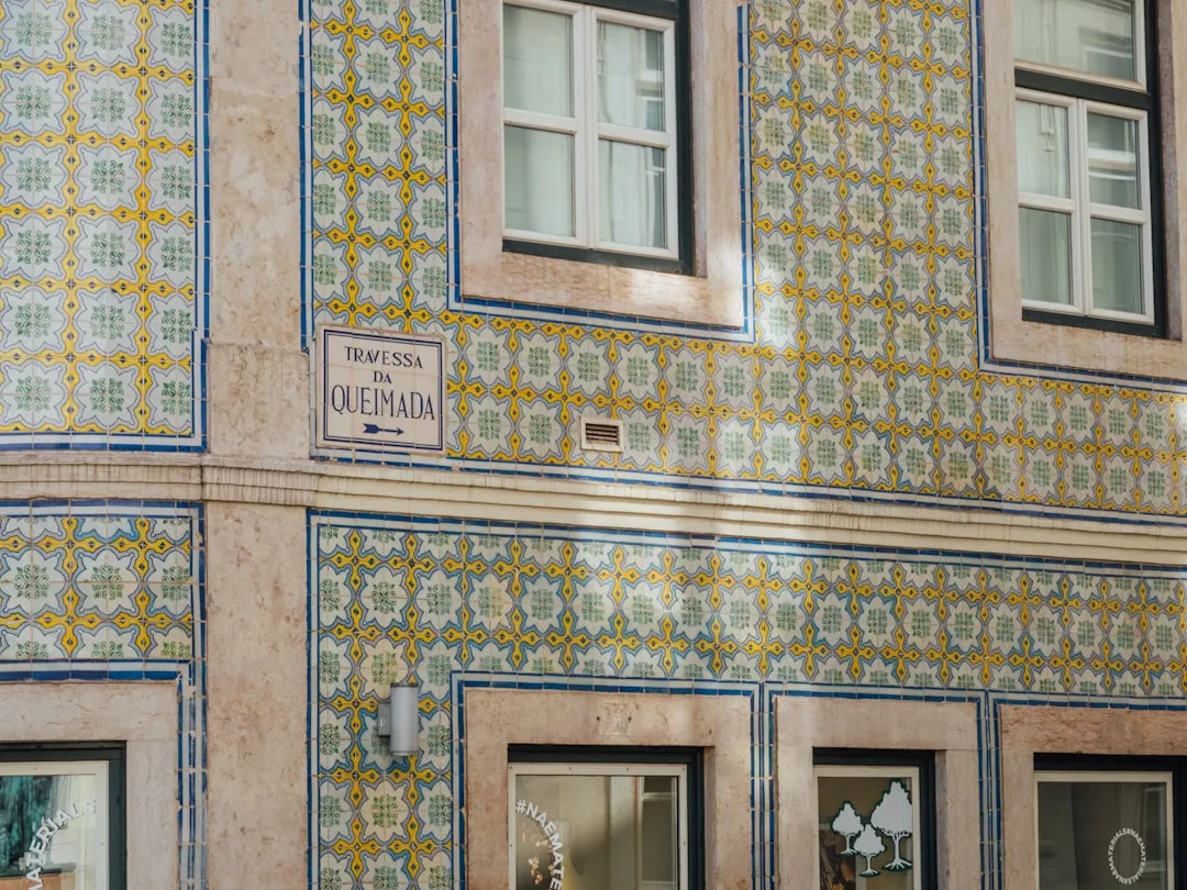 Traditional Portuguese building facade decorated with geometric patterned azulejo tiles
